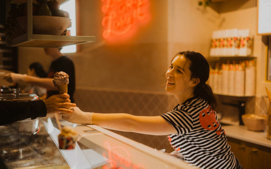 Island Gelato girl hands over douuble scoop